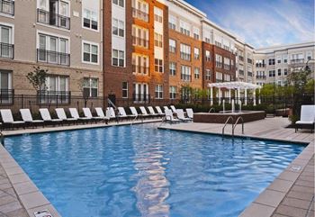 Sparkling resort-style swimming pool with expansive sundeck